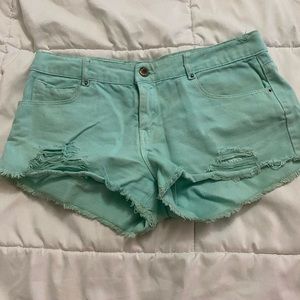 Teal distressed shorts